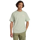 Remera verde de manga corta con logo de New Balance en el pecho.