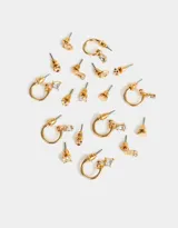 Set de nueve pares de aros pasantes y argollas de metal plateado con strass y esmaltado.