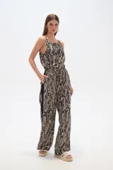 Pantalón de lyocell con estampado abstracto en tonos beige y negro, corte palazzo y cintura elastizada.