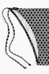 Vedetina de bikini estampada en blanco y negro con tiras para atar en los laterales.