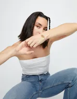 Pulsera de cuero trenzado color rosa con cierre de mosquetón entrelazado bañado en oro de 18k.