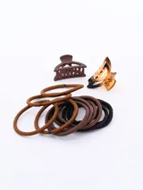 Set de accesorios para el cabello que incluye coleros elásticos en tonos marrón y negro, y pinzas tipo clip en color marrón y carey.