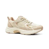 Championes deportivos American Sport Joggy color beige con detalles en dorado y suela gruesa.