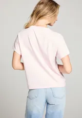 Remera rosa pálido de algodón con cuello redondo y estampado vintage de Bowie en color naranja.