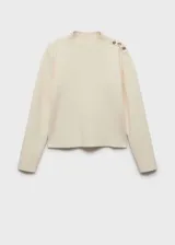 Jersey color crudo de punto fino con cuello perkins, manga larga y detalle de botones metálicos en el hombro. Corte recto.