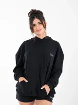 Canguro negro de algodón sin felpa, con capucha y bolsillo tipo canguro. Estampado con la palabra 'GAINS' en el pecho.