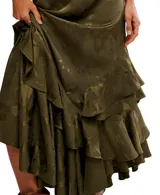 Falda larga color verde oliva con estampado floral jacquard, corte asimétrico y volantes en cascada.