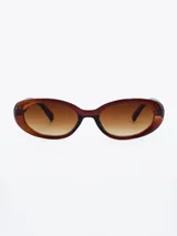 Lentes de sol ovalados con montura de acetato color marrón y lentes degradadas.