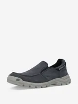 Zapato Caterpillar Threshold Slip On de lona color azul con suela gris.