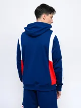 Buzo canguro azul con capucha, mangas rojas y escudo del Club Nacional de Football estampado en el pecho.