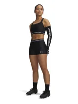 Shorts deportivos ajustados negros para mujer, con pretina elástica ancha que lleva el logo de Under Armour repetido en blanco. Presentan un pequeño logo de Under Armour en la pierna derecha.