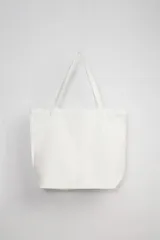 Bolso de mano tipo tote bag color blanco con estampa de caballito de mar color naranja y texto "Sea Horse The Sea Capsule".