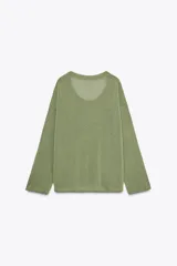 Jersey verde claro de punto con escote redondo y manga larga.