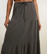 Pollera evasé new midi de algodón color gris, con volados y lazo en la cintura.