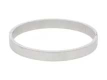 Esclava de acero inoxidable de diseño minimalista, con un grosor de 7 mm y diámetro de 6 cm.