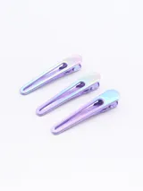 Pack de tres pinzas para el pelo con diseño iridiscente.