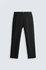 Pantalón largo de vestir gris claro con estampado de cuadros, corte slim fit y cintura elástica. Confeccionado en tejido con alta elasticidad, bolsillos frontales y cierre frontal con cremallera y botón.