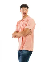 Remera polo verde con cuello y mangas con borde blanco, confeccionada en algodón.