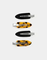 Set de cuatro hebillas para el pelo, dos de color negro y dos con estampado carey.