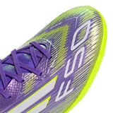 Championes de fútbol 5 Adidas F50 League TF unisex, color violeta con detalles en amarillo y blanco. Diseñados para césped sintético, con capellada Fiberskin, diseño Sprintgrid, lengüeta elástica, entresuela EVA y suela Sprintplate 360.
