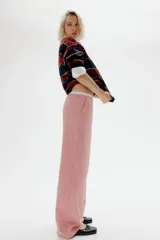 Pantalón de popelina de algodón a rayas rojas y blancas, con cintura elástica, cordón ajustable y bolsillos laterales.