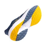 Championes deportivos Joma Elite 2503 para hombre, color azul marino con detalles en amarillo. Capellada de tejido transpirable con jacquard personalizado y perforaciones VTS. Entresuela de phylon flexible y suela de goma resistente a la abrasión.