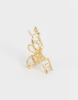 Broche dorado para el pelo con forma de moño.
