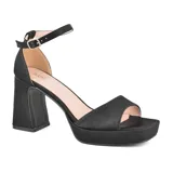 Sandalias de vestir negras con plataforma y tacón cuadrado alto. Tira delgada al tobillo con hebilla ajustable.