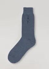 Medias de caña alta color azul con diseño geométrico en la parte superior.