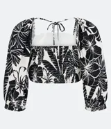 Top corto de lino, con tiras para lazo en la espalda, mangas 3/4, lastex en la parte trasera y estampa floral estilo tropical.