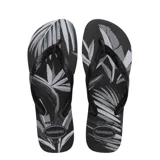 Sandalias Havaianas modelo Aloha, con base estampada con hojas en blanco y negro, y tiras negras.