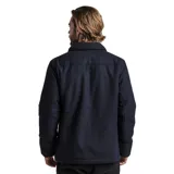 Campera de paño azul oscuro con cuello de corderito, cierre con botones a presión y múltiples bolsillos.