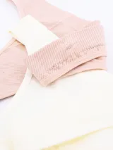 Pack de dos colaless sin costuras, uno color beige claro y otro rosado pálido, ambos con textura acanalada.