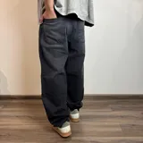 Pantalón de jean gris oscuro con efecto lavado, corte amplio y tiro alto.