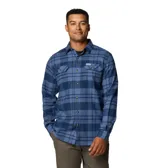 Camisa de franela Columbia para hombre, a cuadros en tonos negro, gris, beige y blanco. Confeccionada en algodón con elastano para mayor comodidad y flexibilidad. Cuenta con cuello abotonado, cierre frontal con botones, dos bolsillos en el pecho con cierre de botón y puños abotonados.
