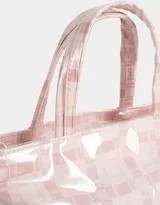 Lunchera tipo bolso con estampado escocés en tonos rosados y transparente. Tiene doble asa corta y etiqueta con logo en el frente.