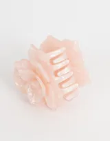 Broche para el pelo de acrílico color rosa claro con forma de flor.