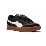 Championes Puma Park Sk8 negros con detalles en blanco y suela color caramelo.