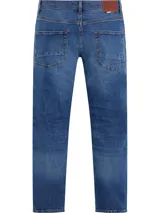 Pantalón de jean azul con efecto desgastado, corte recto y tiro medio.