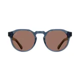 Lentes de sol Indie Honey con montura redonda color azul y lentes marrones polarizadas.