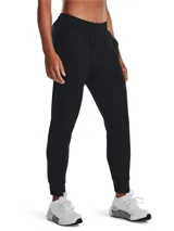 Pantalón de chándal Under Armour Unstoppable para mujer, color negro, con cintura elástica, bolsillos laterales con cierre y corte ajustado.