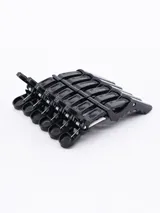 Pack de seis pinzas negras para el pelo, con agarre antideslizante y resorte metálico.