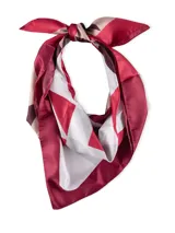 Pañuelo de seda con estampado geométrico en tonos rojo, blanco y beige.