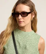 Vestido evasé midi sin mangas confeccionado en viscosa con cuello alto redondo, cierre delantero por gota, recortes fruncidos y estampa de lunares.