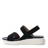 Sandalias Lady Confort Vitre con tiras elásticas cruzadas en empeine y tobillo, base blanca y plantilla marrón.