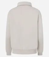 Saco femenino cerrado de algodón con felpa más sostenible, color beige. Presenta cuello polo con abotonado parcial, manga larga y bajo ajustado.