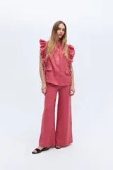 Pantalón palazzo color crudo, confeccionado en lino 100%.