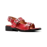 Sandalias bajas negras de cuero sintético, con hebillas plateadas y suela track.