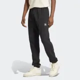 Pantalón de jogging negro Adidas de corte ceñido, confeccionado en felpa francesa. Cuenta con cintura elástica con cordón ajustable, bolsillos laterales, puños acanalados y logo del Trifolio en la pierna.