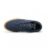 Championes Etnies Blitz de lona azul marino con logo de la marca en el lateral y suela de goma color caramelo.